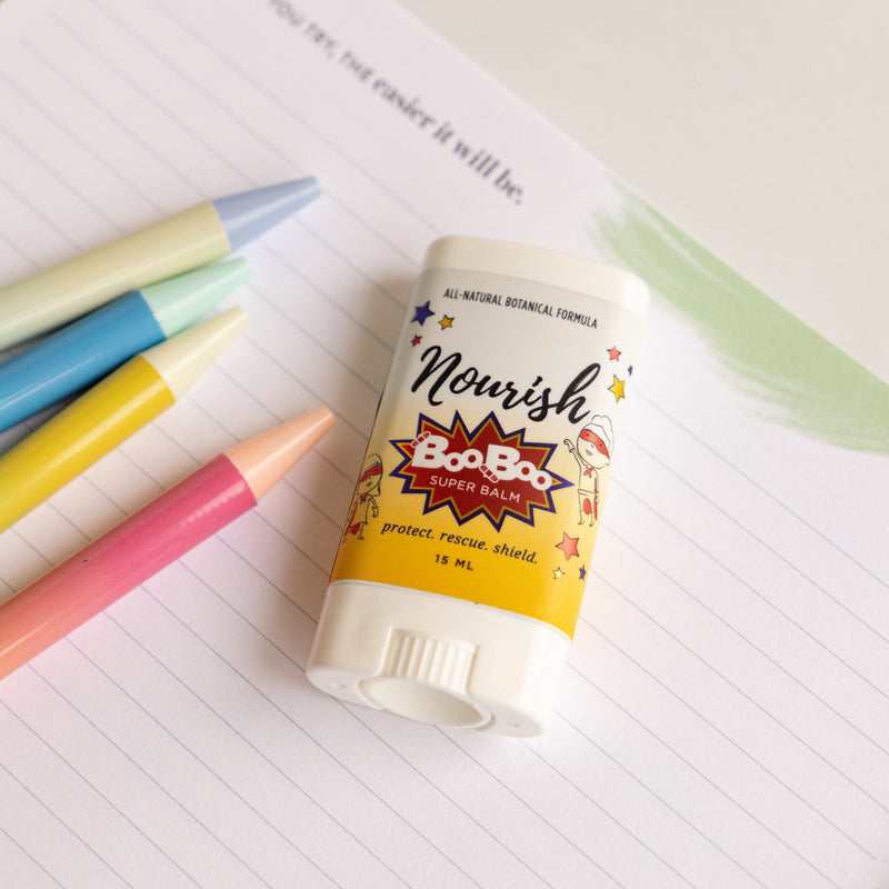 Boo Boo Balm on a notebook with colorful markers