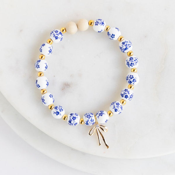 Essential Oil Diffuser Bracelet: Blue Floral Beads w/ Gold Ribbon Charm