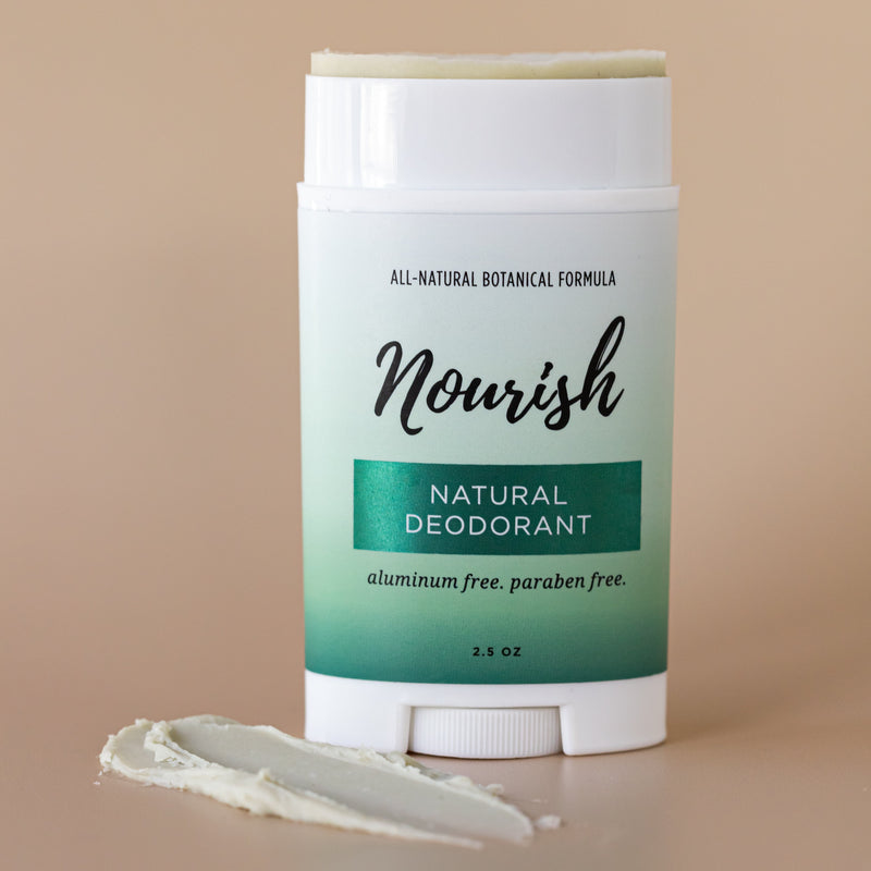 Natural Deodorant tube against beige background