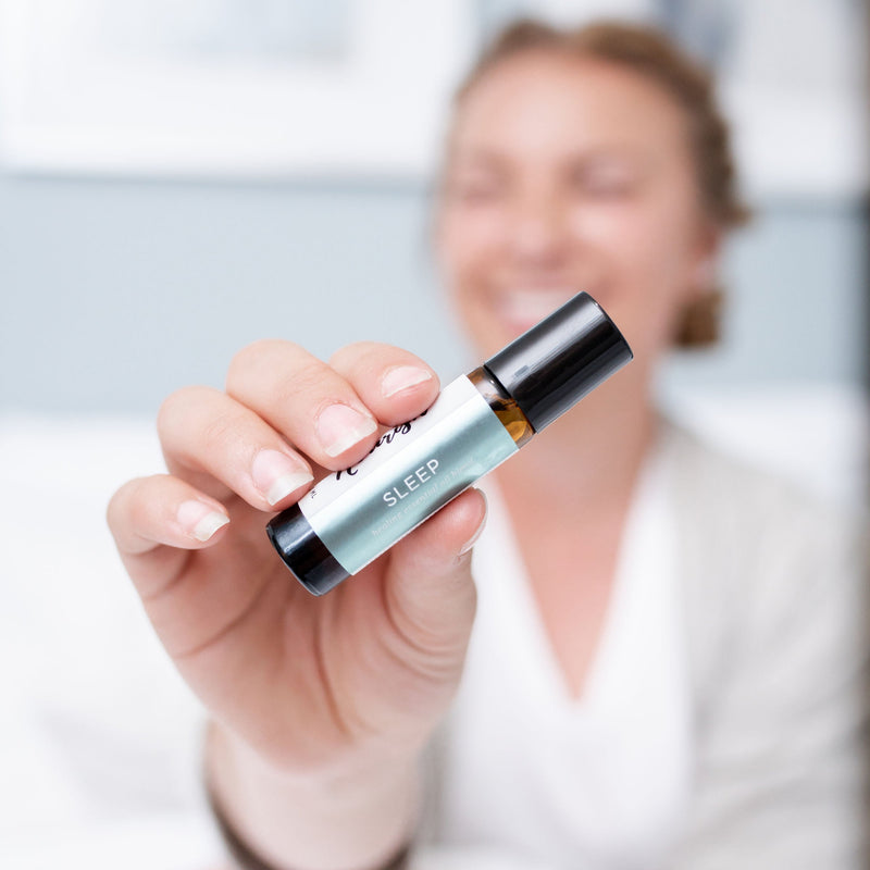 Person holding a Sleep Roller Blend with a blurred background